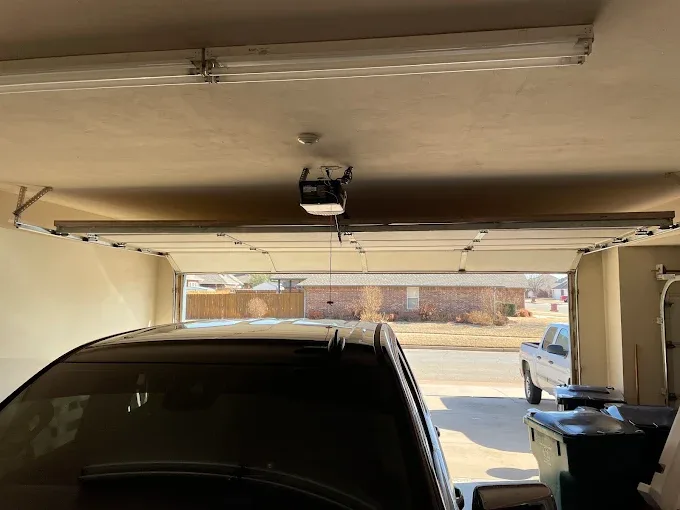 Garage door opener and track system interior view by Affordable Door Co Oklahoma City